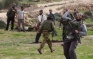 Settlers Assault Palestinian Farmers and Activist