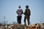 Israeli soldiers beat, arrest Palestinian activist during olive harvest