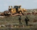 Occupation Forces Destroy Palestinian-owned Land, Seize Vehicle, Three Tractors in the West Bank