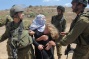 Daughters fight to save mother from arrest in Nabi Saleh