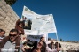 PHOTOS: Palestinian Christians protest Israeli permit regime during Palm Sunday procession