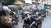Israeli soldiers pose for photos while abusing Palestinian child