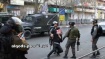 Israeli soldiers pose for photos while abusing Palestinian child