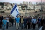 Israeli forces escort settlers as they stone Hebron homes