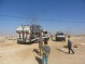 Israeli forces seize a tractor, its truck, four water tanks, and three bases from Susiya village