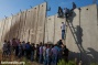 PHOTOS: Palestinians climb over the wall into Jerusalem for Ramadan