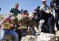 Video: Women of Nabi Saleh take down Israeli soldier assaulting injured child