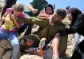 Video: Women of Nabi Saleh take down Israeli soldier assaulting injured child