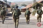 Israeli forces detain 12 overnight, threaten village over stone-throwing