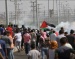 Israeli Army Injures Three Palestinians During Protest in Central Gaza