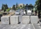 Israeli soldiers isolate Jabal Al-Mokabber with concrete blocks