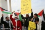 PHOTOS: Palestinian Santas protest the occupation in Bethlehem