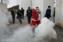 PHOTOS: Palestinian Santas protest the occupation in Bethlehem