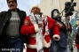 PHOTOS: Palestinian Santas protest the occupation in Bethlehem