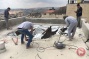 Palestinian family coerced to tear down their roof in Beit Hanina