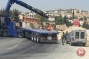 Israeli forces install iron gate at an entrance of Bethlehem-area town