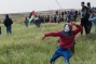 Photos: Tens of thousands march on Gaza border, Israeli troops open fire