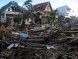 3 photos of houses and costal road destroyed at Palo, Leyte