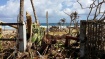 2 photos of devastated surf camp at Calicoan island, Guiuan