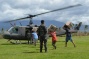 3 photos of AFP and Gawad Kalinga volunteers providing food packs and water bottles at Batbatan and Manigin islands