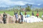 3 photos of AFP and Gawad Kalinga volunteers providing food packs and water bottles at Batbatan and Manigin islands